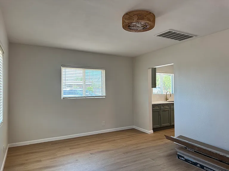 Living Room towards the Kitchen. Final Touches being done to get ready for your move in!