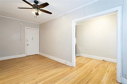 Spacious Living room with original hardwood floors and lot's of natural light!