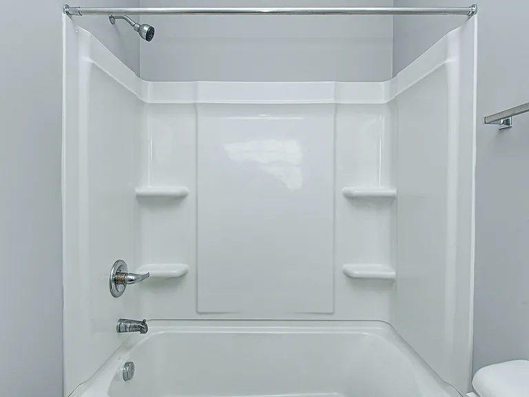 Enjoy the comfort of a spacious shower/tub combo_ideal for both quick routines and relaxing evenings in.
