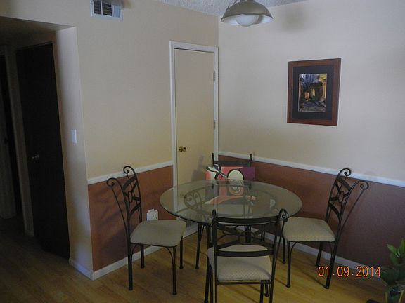 Spacious dining area between kitchen and living room