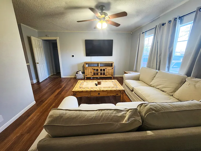 Living room from front door entrance but will not include the furniture. The door by the TV is the MIL room/bathroom