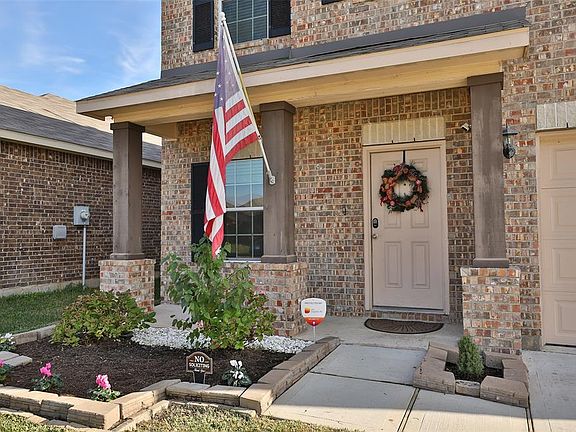 LOOK AT THAT ADORABLE FRONT PORCH - The landscaping was recently freshened and underneath the rocks is a french drain that was installed after the home was purchased! Additional bonus is that this home is pre-wired with an alarm system and has instal