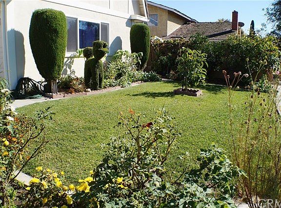 Front yard- lush grass & flowers