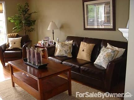 Living Room : Features a wood burning fireplace.