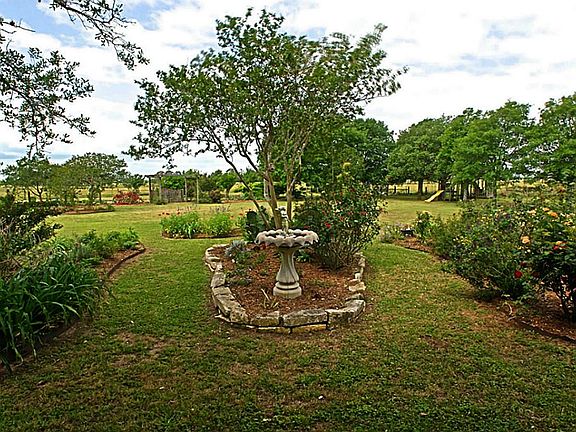 The flower beds are meticulously designed and well maintained with mostly low maintenance flowers and bushes.