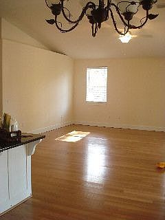 View of living space from dining space and kitchen.