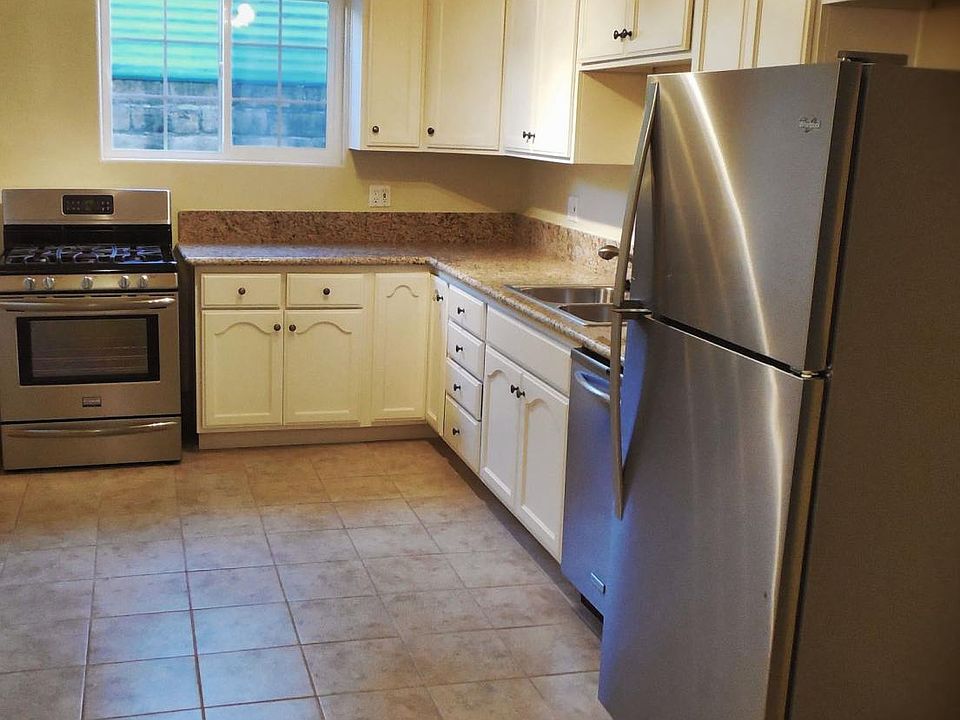 Granite countertops, custom solid wood cabinets, and stainle