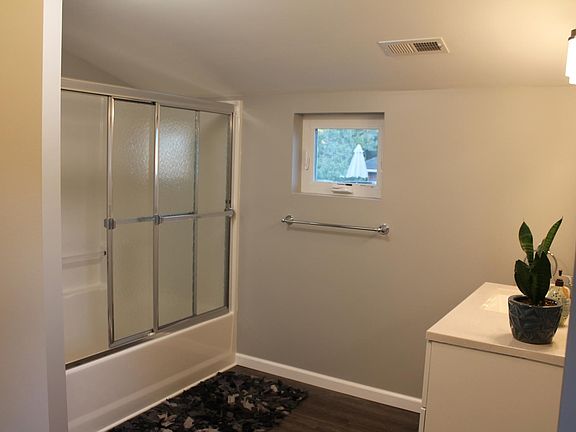 Bathroom View: Shower (Unit has exhaust fan with LED nightlight)