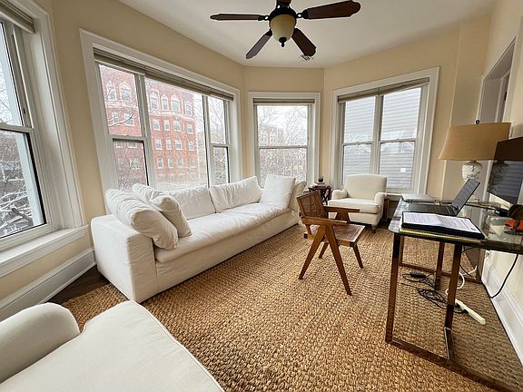 Gracious east facing sunroom perfect for office, den, lounge, reading room. Picture windows, morning sun, ceiling fan, open windows and enjoy the breeze.