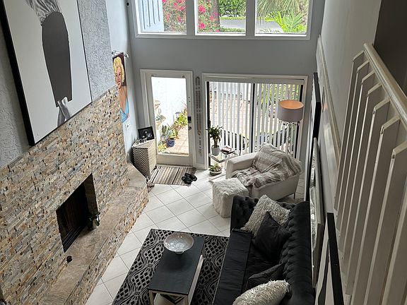 Birdseye view of living room and large windows