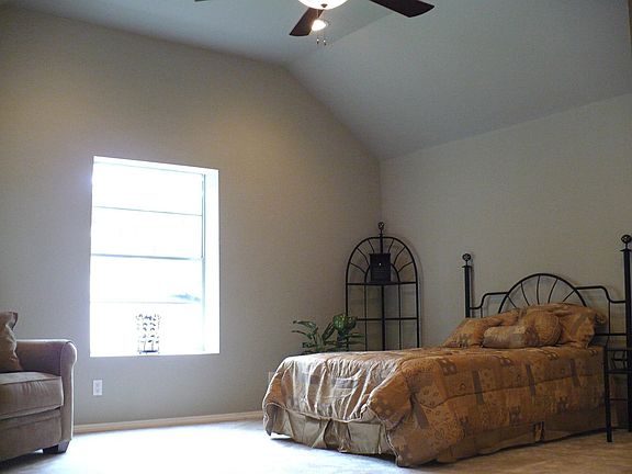 One of two bedrooms upstairs, master + 3 downstairs