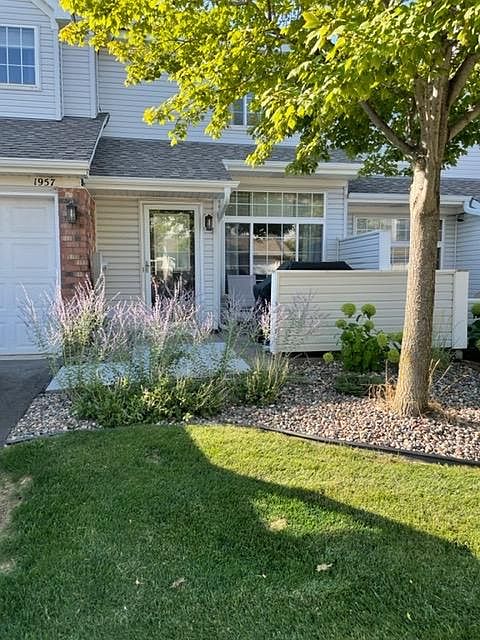 Front of unit w/single car garage