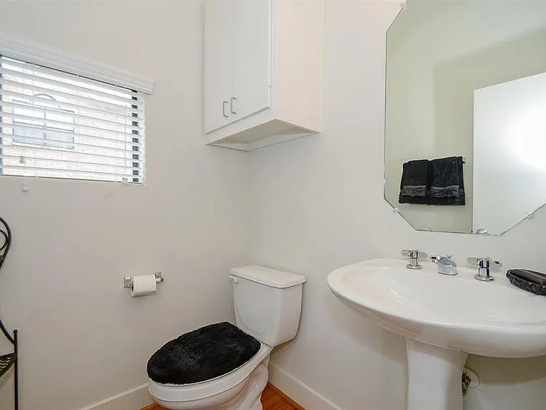 Upstairs half bathroom conveniently located for guest