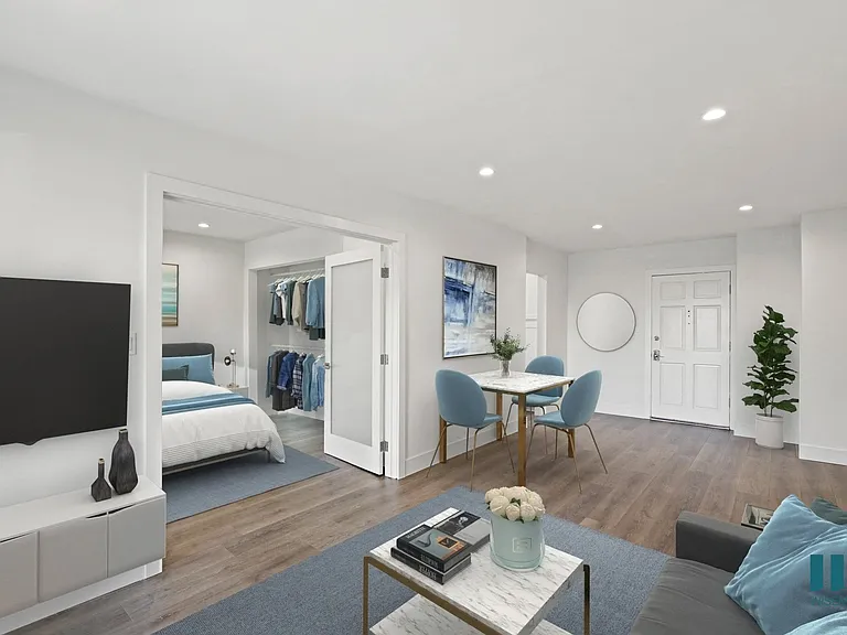 Open-Concept Dining and Living Room with Double Doors Leading to Bedroom with Closet