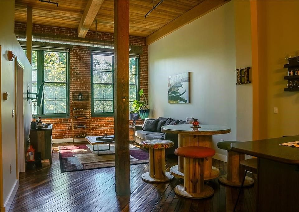 Come home to Unit 204 of the Lofts at Allen Street, an idyllic refuge in a re-purposed mill setting.