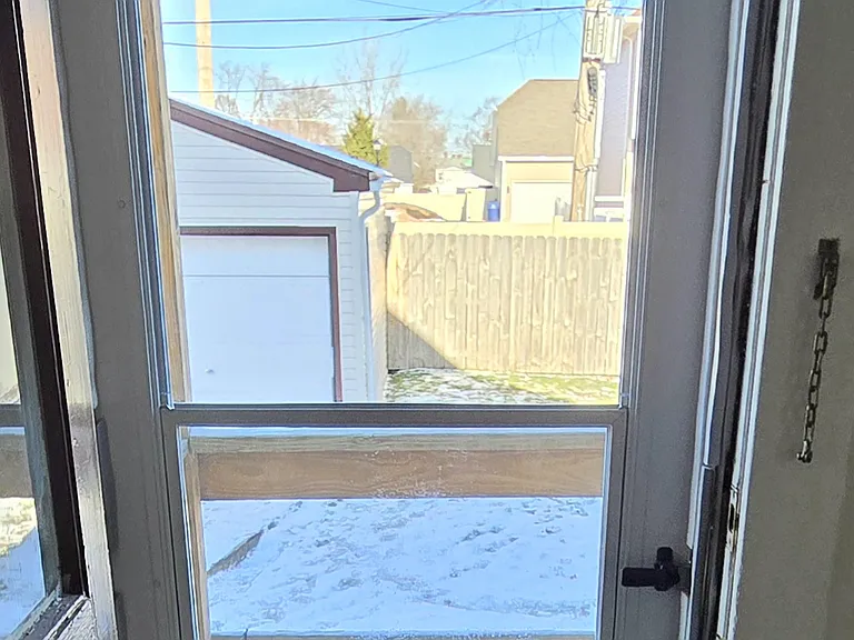 Storm/Screen door in back bedroom