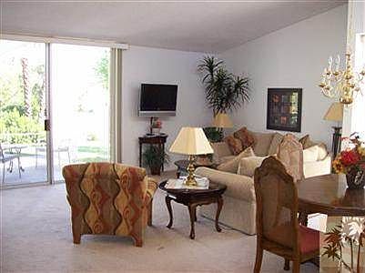 Living room, which is nicely decorated in pleasant tones, ha