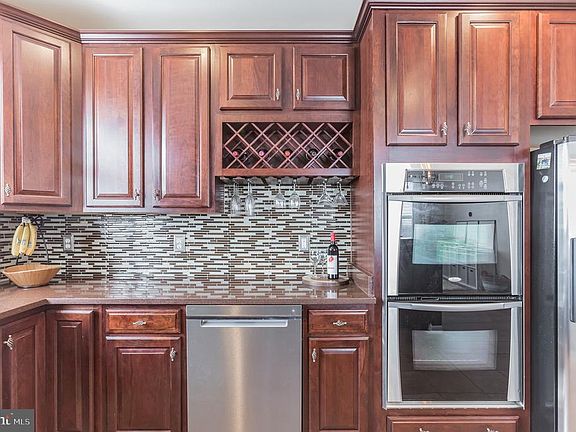 Cherry Cabinetry and SS appliances throughout