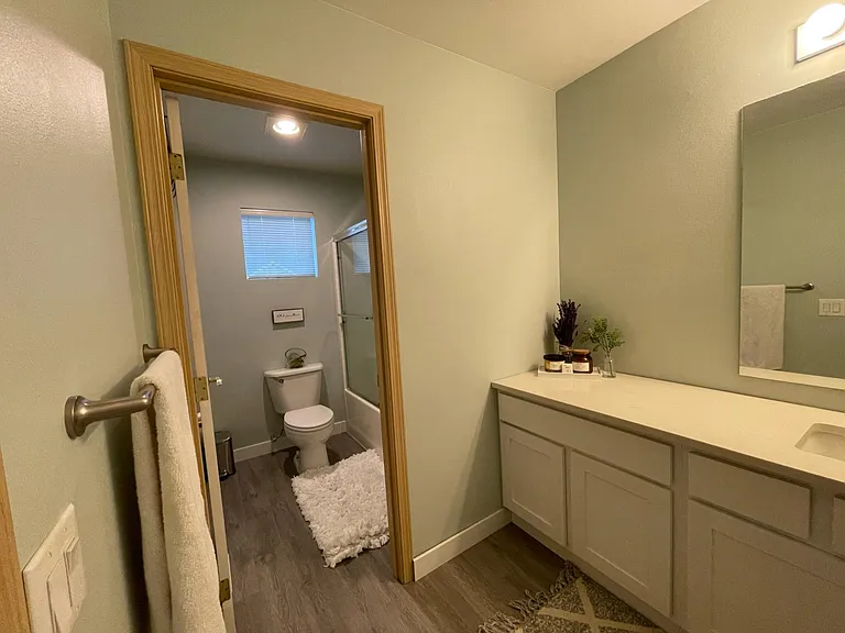 Full bathroom upstairs with separate door into toilet and shower/bathtub
