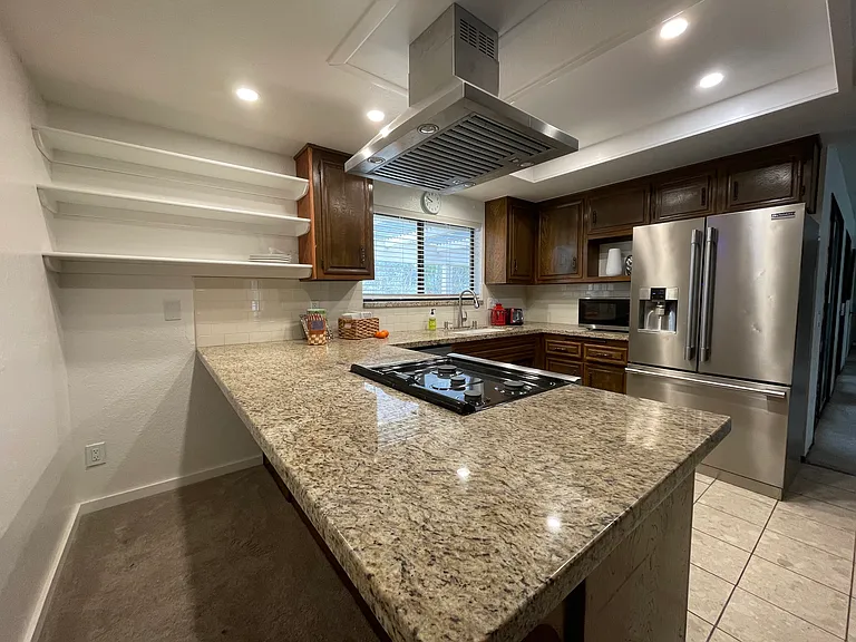 Kitchen updated multiple times over the years, most recently November 2024 (ceiling, lighting, painting and major reconfiguration).