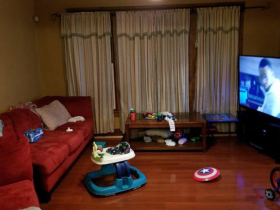 Living room with remote control reversible ceiling fan