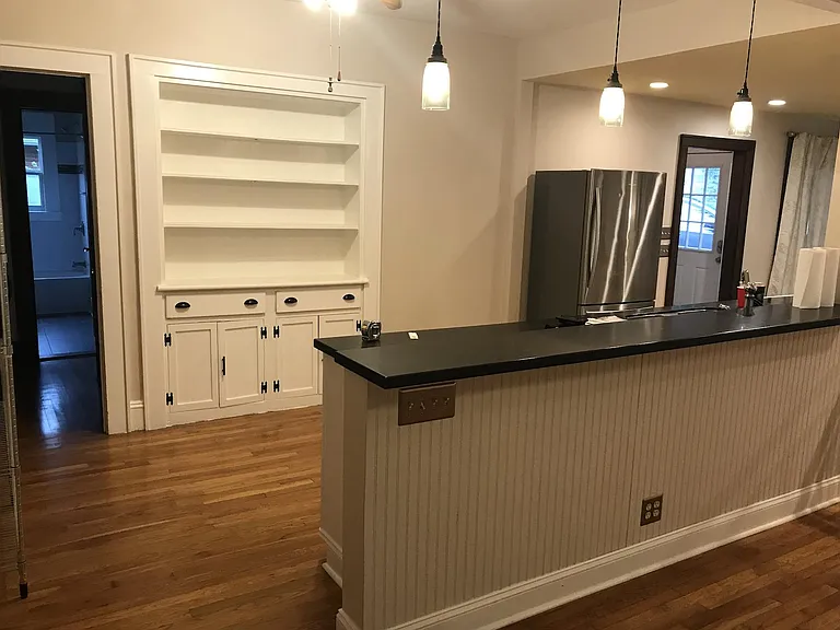 Second view of Kitchen with built-ins for storage.