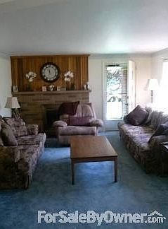 Living Room leads to porch with view.
						:
						Will accommodate all of your furniture. Hardwood floors beneath carpet.