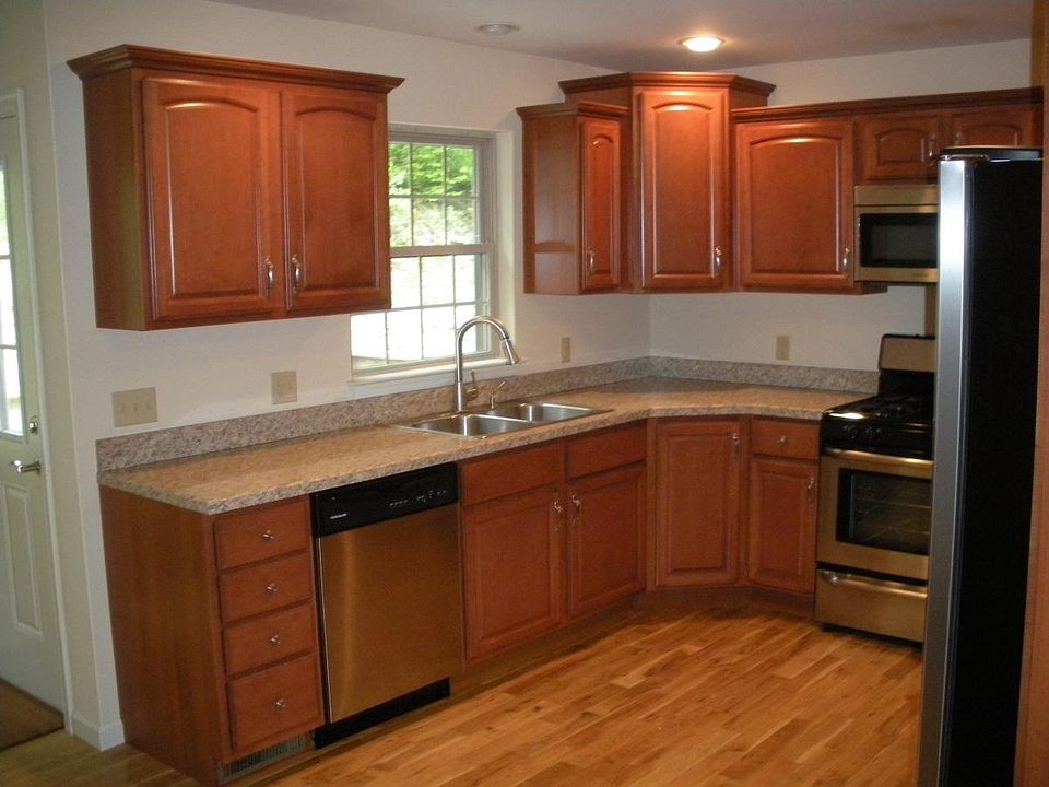 Kitchen with dishwasher, gas stove, microwave and refrigerat