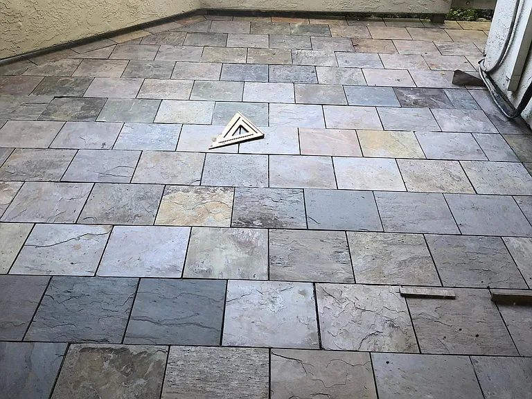 Large patio with outdoor closet area