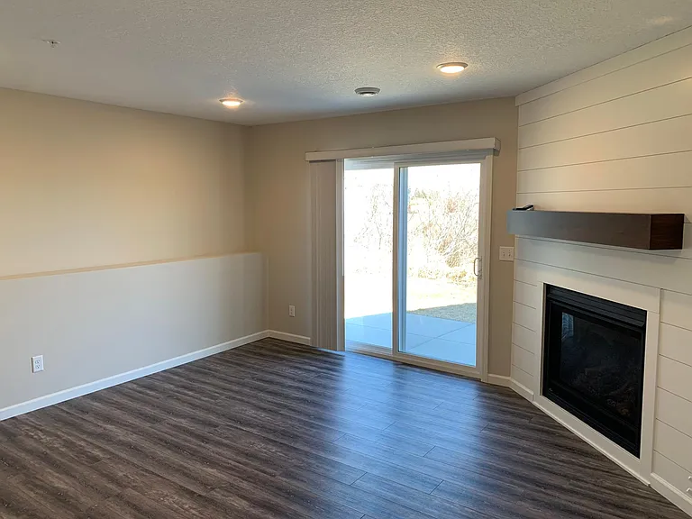 Lower Level Family Room With Gas Fireplace and Walk Out To Patio!