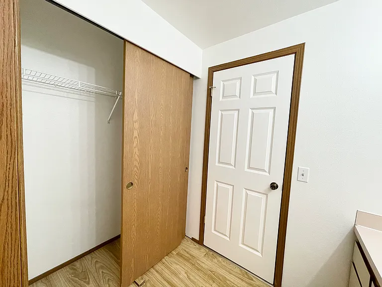 Double Door Full Size Closet in bathroom