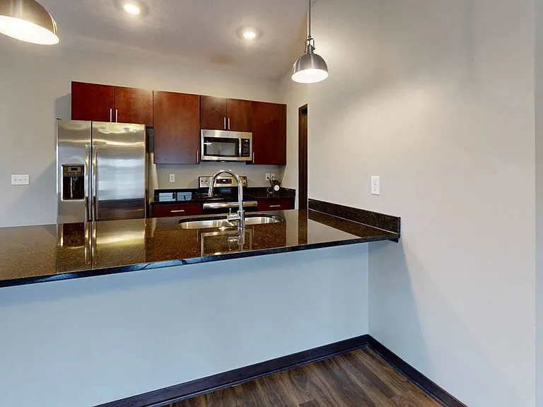 Modern kitchens with sleek appliances and granite countertops offer the ideal setup for cooking and entertaining.