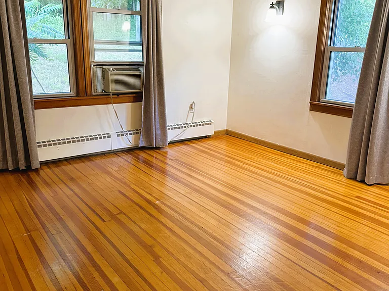 First floor 3rd bedroom with closet and hardwood floors