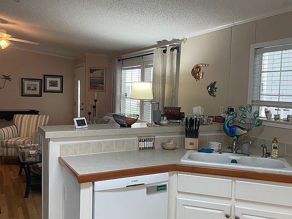 Fully Equipped Kitchen with adjacent Laundry Room and Pantry