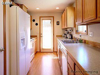 Kitchen, with door to patio and back yard