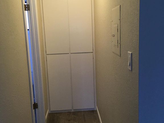 downstairs linen closet next to half bath
