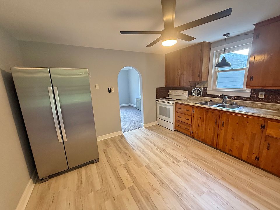 Stainless refrigerator & NEW luxury vinyl plank floors!