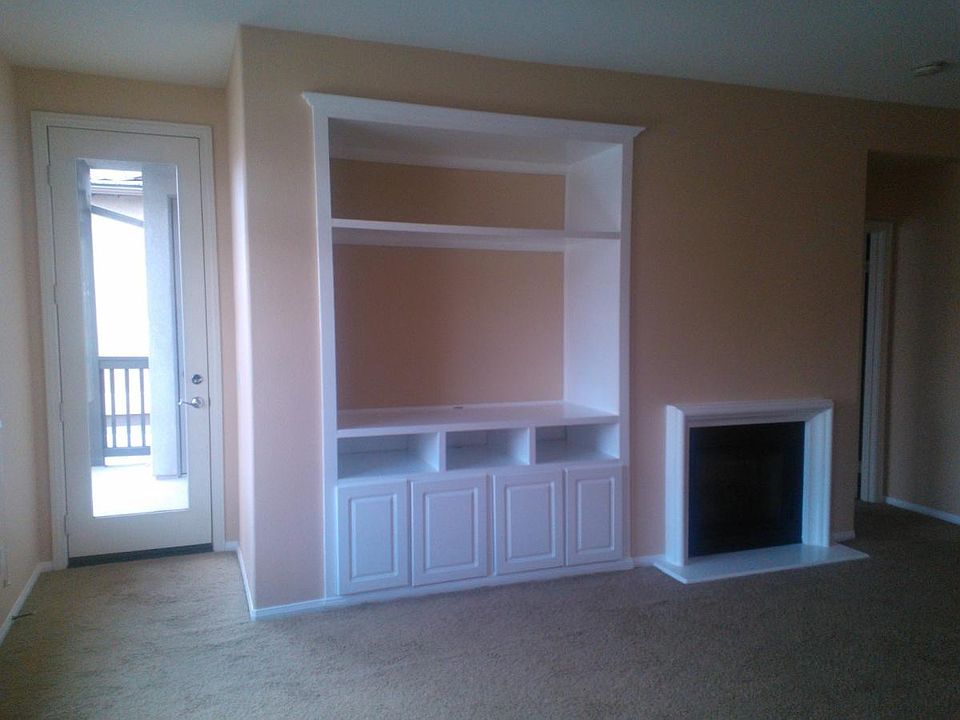 Entertainment hutch and door to patio
