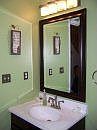 Downstairs Half Bath new mirror, sink, and faucet.