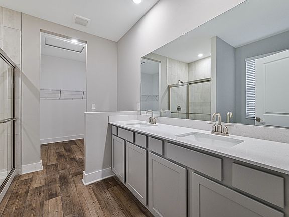 The gorgeous master bathroom is the perfect place to get ready in the mornings