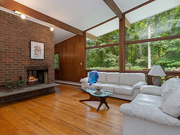 Living Room w/vaulted beamed ceiling - Brick FPL
