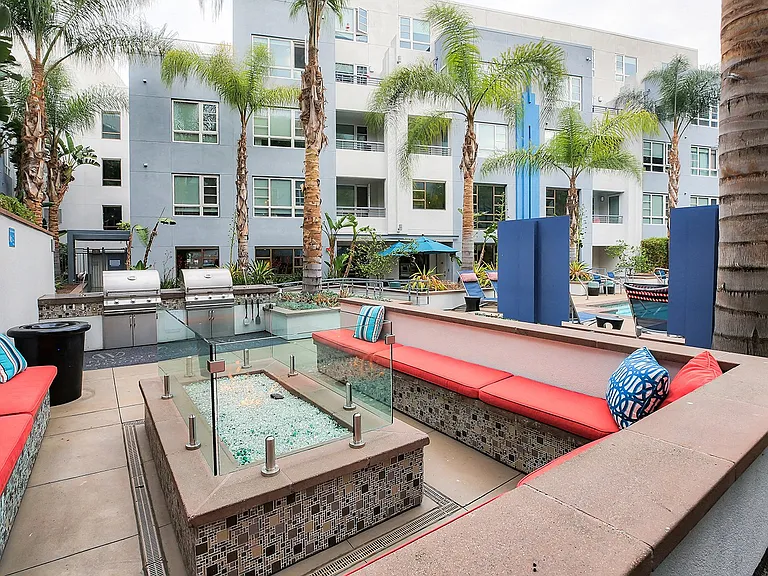 Poolside lounge with a fire pit invites residents to enjoy beautiful LA nights