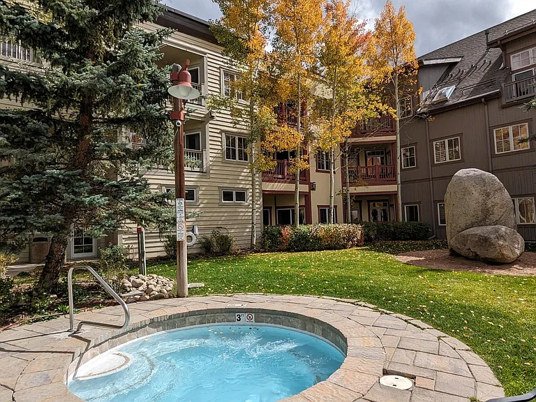 Year-round hot tub with seating up for up to 12 and massage jets around the perimeter.
