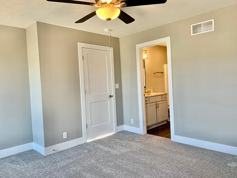 Master bedroom leading to the en-suite bathroom