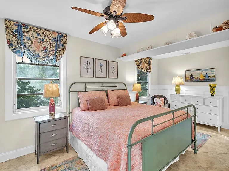 Spacious primary bedroom with King bed, walk in closet and 3/4 en suite bath