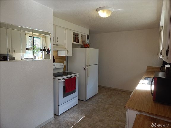 Kitchen linoleum was replaced within last couple years, cabinets were painted. Appliances stay!