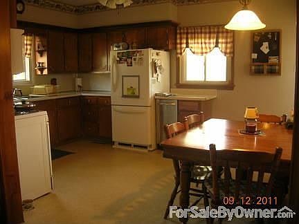 spacious kitchen : the only appliance staying is the stove..the laundry and .5 bath is to the right