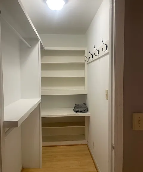 Great walk-in closet with recently built-in shelving for more storage.