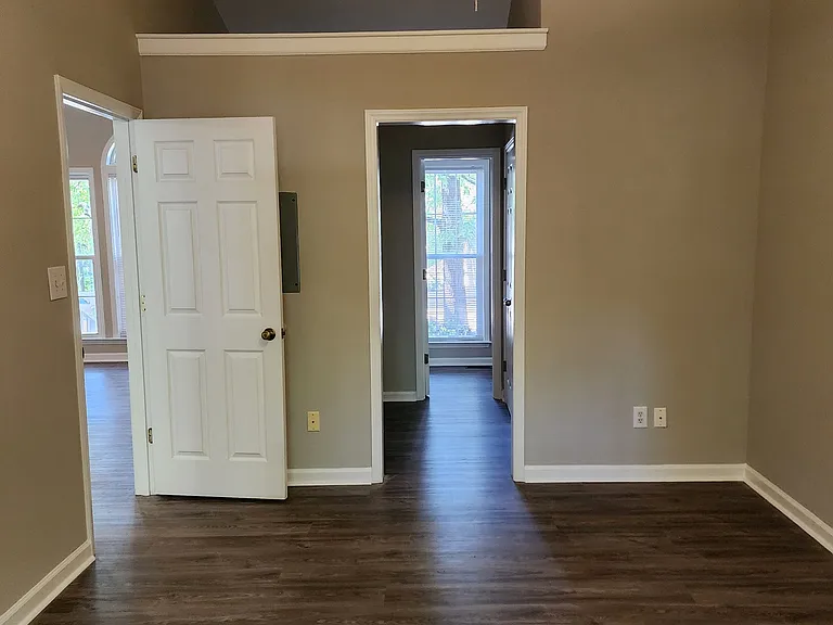 View from rear of master bedroom into ensuite dressing and bath area.
