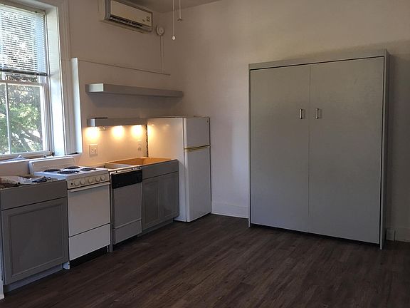 New kitchen cabinets, flooring, floating shelves and Murphy bed. Awaiting new granite countertops.